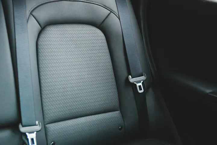 Car seat with a fabric centre and a seatbelt