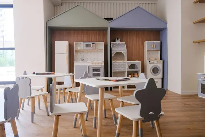Childcare room with child-sized tables and chairs