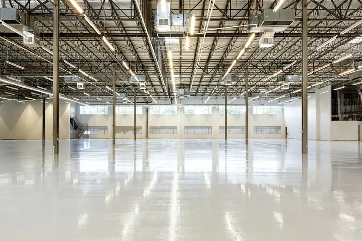 Empty warehouse with a polished concrete floor